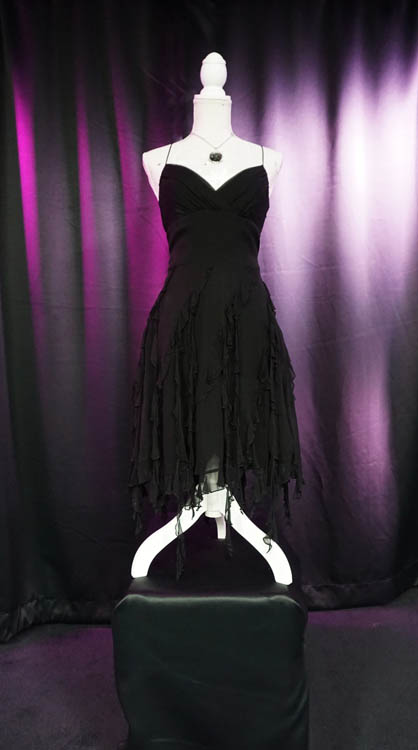 Long black spaghetti strap wedding dress with flowy bottom available for rent at Sci-Fi Wedding Chapel.